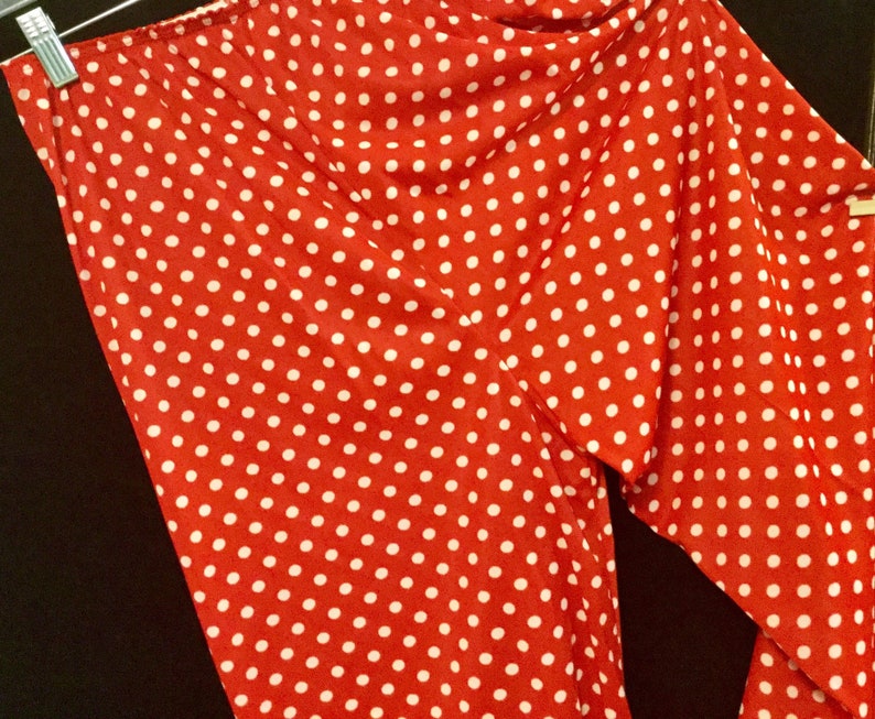 May include: Red pants with white polka dots.