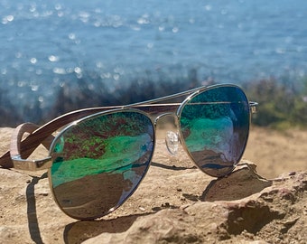 Canyon Green Coyote, handmade zebra wood arms, silver frame, polarized green mirror lenses.