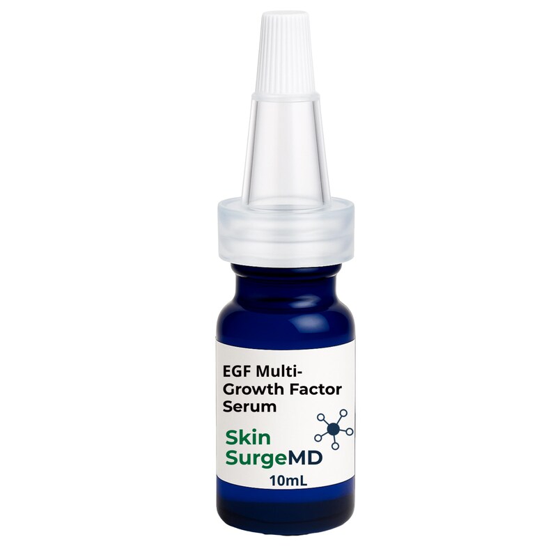 May include: A small dark blue glass bottle of EGF Multi-Growth Factor Serum by Skin SurgeMD. The bottle features a white label with black and green text, a 10mL volume indicator, and a clear plastic pointed applicator cap with a white tip.