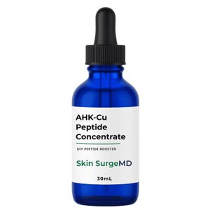 May include: A cobalt blue glass dropper bottle with a black cap and a white label. The label features the black text AHK-Cu Peptide Concentrate, the text DIY PEPTIDE BOOSTER, the green text Skin SurgeMD, and the black text 30mL at the bottom.