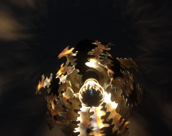 Ceiling lamp-chandelier-flambéed-unique-rawcut, made of metal in cutting torch design