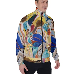 May include: A colorful abstract art print jacket with a zipper closure. The jacket features a variety of colors, including blue, yellow, red, and white.