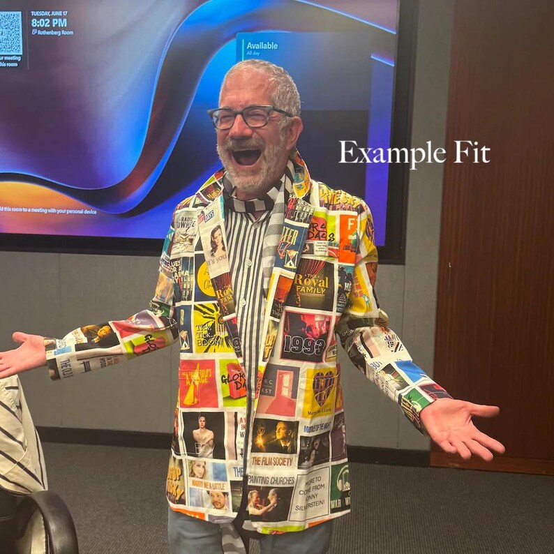May include: A blazer featuring a collage of various colorful rectangular graphic prints and text, worn over a black and white vertically striped shirt. The blazer has a notched lapel and long sleeves, with the text Example Fit visible on the right.