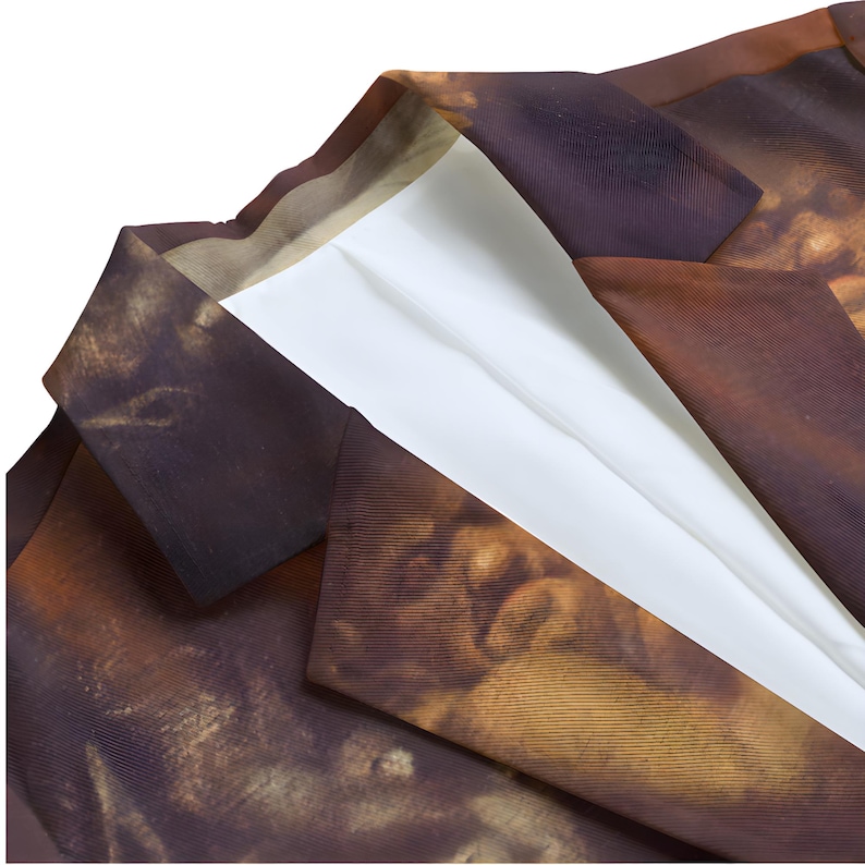 May include: A blazer featuring a dark brown and tan abstract print with a classic notched lapel collar. The garment is lined with a solid white fabric visible at the neckline and along the front opening, showcasing a structured tailored design.