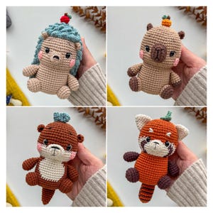 May include: Four handmade crochet animal toys: a hedgehog, a bear, an otter, and a red panda. Each toy has a unique color scheme and a small decorative element on its head. The toys are held in a person's hands.