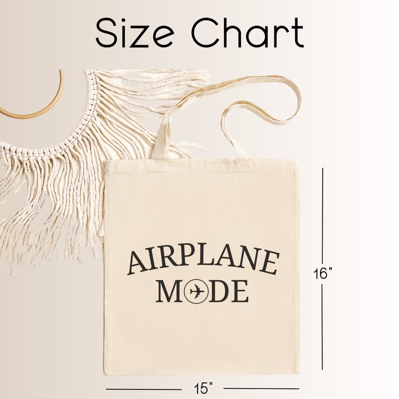 May include: A white canvas tote bag with black text that reads "AIRPLANE MODE" and a small airplane icon. The bag is 15 inches wide and 16 inches tall.