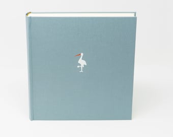 Baby photo album, powder blue fabric cover, 30 x 30 cm, white stork