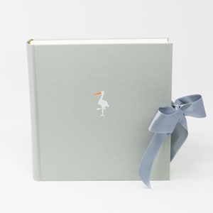 Photo album, light grey, satin ribbon , 23 x 24  cm, white stork