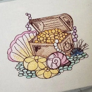 May include: Embroidered design of a treasure chest filled with gold coins and pearls, surrounded by seashells and coral. The design is in shades of brown, yellow, pink, and blue.
