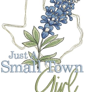 May include: An embroidered design featuring a bluebonnet flower and an outline of the state of Texas. The text "Just A Small Town Girl" is embroidered below the flower.