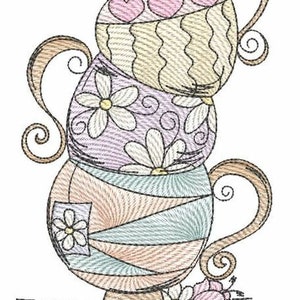 May include: A stack of three teacups with whimsical designs. The top cup has a light brown and cream color with pink hearts. The middle cup is purple with white flowers. The bottom cup is light blue and brown with a swirl pattern.