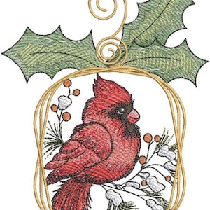 May include: A red cardinal bird ornament with a gold wire frame and holly leaves. The bird is perched on a branch with white berries and green pine needles.