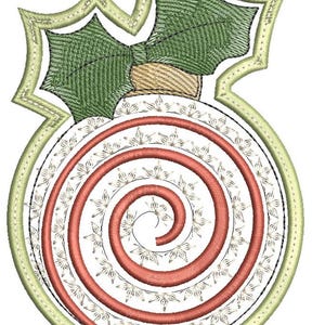 May include: Embroidered Christmas bauble with a spiral design. The bauble features a red spiral, a white background, and a green holly leaf design at the top. The bauble is outlined in a light green colour.