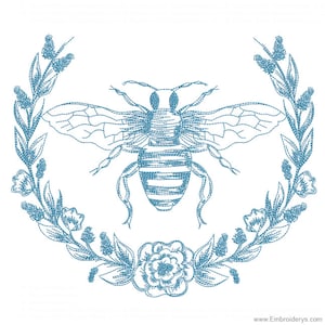 May include: A blue embroidered design of a bee surrounded by a wreath of flowers. The bee has a striped body and wings. The flowers are stylized and have a simple design.