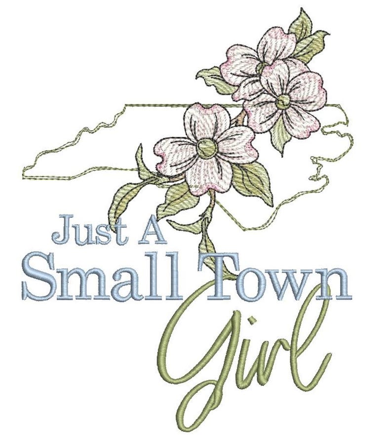 May include: An embroidered design featuring a stylized outline of the state of North Carolina with pink and white dogwood flowers and green leaves. The text "Just A Small Town Girl" is embroidered below the flowers in blue and green thread.