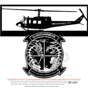 May include: Black metal silhouette of a helicopter with "MARINES" text. Below is a circular emblem with a devil and snake design, and the text "GUNRUNNERS". The text "LIGHTS ARE OUT... FIGHTS STILL ON" is also present. The dimensions are 20"x24".