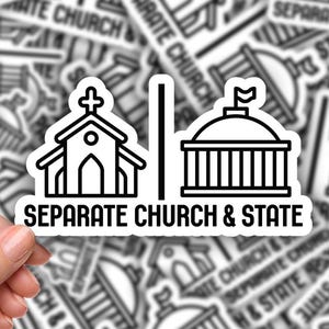 May include: A black and white sticker with the text "SEPARATE CHURCH & STATE" and an illustration of a church and a government building. The sticker is held by a hand, with many similar stickers in the background.