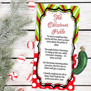 May include: A Christmas-themed card with a red and white polka dot border and green and white striped top. The card reads "The Christmas Pickle" and includes text about a holiday tradition. A green pickle ornament and peppermint candies are also visible.