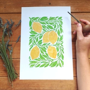 Vibrant pop of colour hand-printed lino print. A4 lemon fruit wall art. Yellow/gold and bright green.