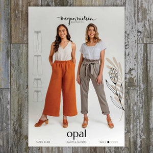 May include: A sewing pattern titled "opal" featuring illustrations of trousers and shorts. The pattern includes images of different styles of trousers and shorts. Two women model the trousers and shorts. The pattern is by Megan Nielsen Patterns.