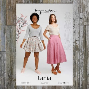 May include: A sewing pattern titled "tania" by Megan Nielsen Patterns. The pattern features illustrations of culottes and skirts. The image shows two women wearing the garments. The pattern's skill level is indicated by three black dots.