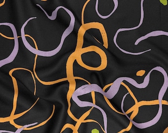 Swishy Viscose Twill Fabric in Misty Black by Atelier Brunette | Designed in France | Swirling strokes of orange & lilac on a black base