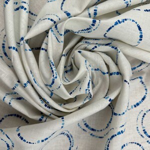 Hikari Circles Linen Cotton Fabric by Art Gallery in a twist.