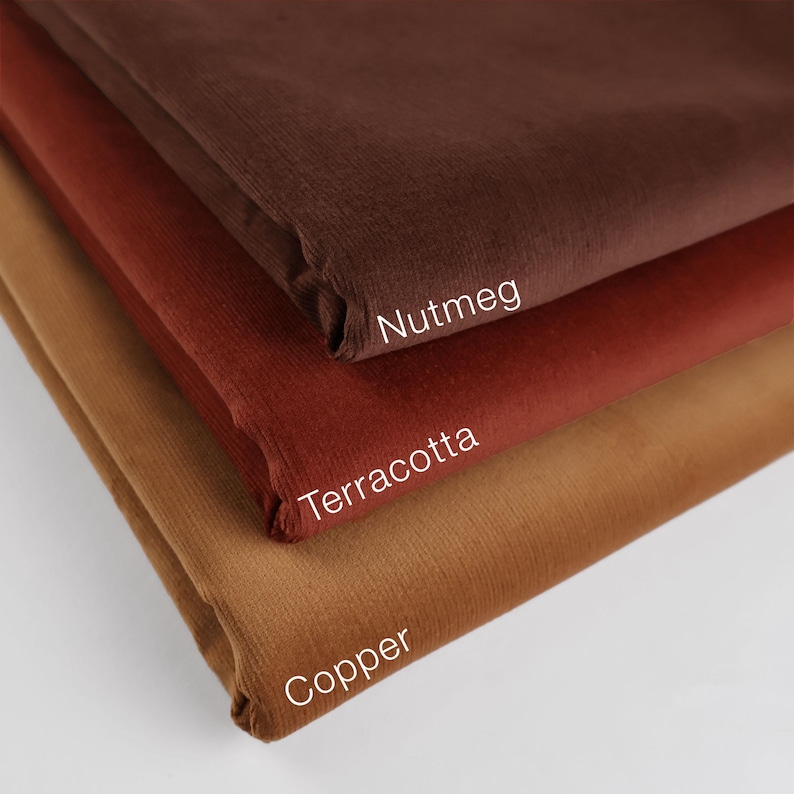 May include: Three fabric swatches in shades of brown, orange, and tan. The swatches are labeled "Nutmeg", "Terracotta", and "Copper".