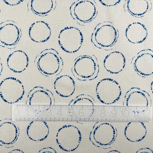 Hikari Circles Linen Cotton Fabric by Art Gallery with a ruler for scale.