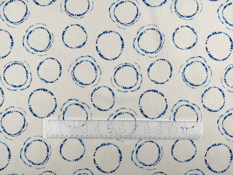 Hikari Circles Linen Cotton Fabric by Art Gallery with a ruler for scale.