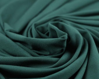 Flowy Bamboo Jersey Fabric in Hunter Green | Midweight, opaque knit fabric with fluid drape, subtle sheen, and 4 way stretch