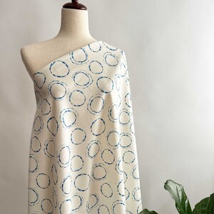 Hikari Circles Linen Cotton Fabric by Art Gallery on a dressform.