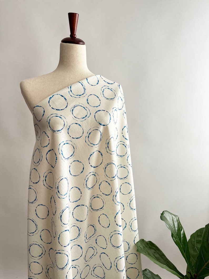 Hikari Circles Linen Cotton Fabric by Art Gallery on a dressform.