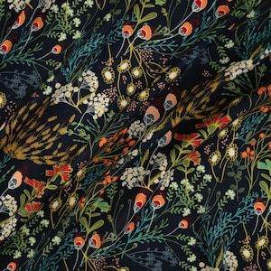 May include: A dark navy blue fabric featuring a dense botanical print of wildflowers, including orange and red buds, white clusters of small blossoms, and thin green stems. The pattern is repeated across the surface with varied floral elements.