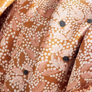 Viscose Crepe Fabric in Lucie Ochre by Atelier Brunette | Designed in France | Ochre orange dot print with cream and taupe leaves
