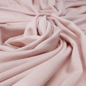 Flowy Bamboo Jersey Fabric in Shell Pink | Midweight, opaque knit fabric with fluid drape, subtle sheen, and 4 way stretch
