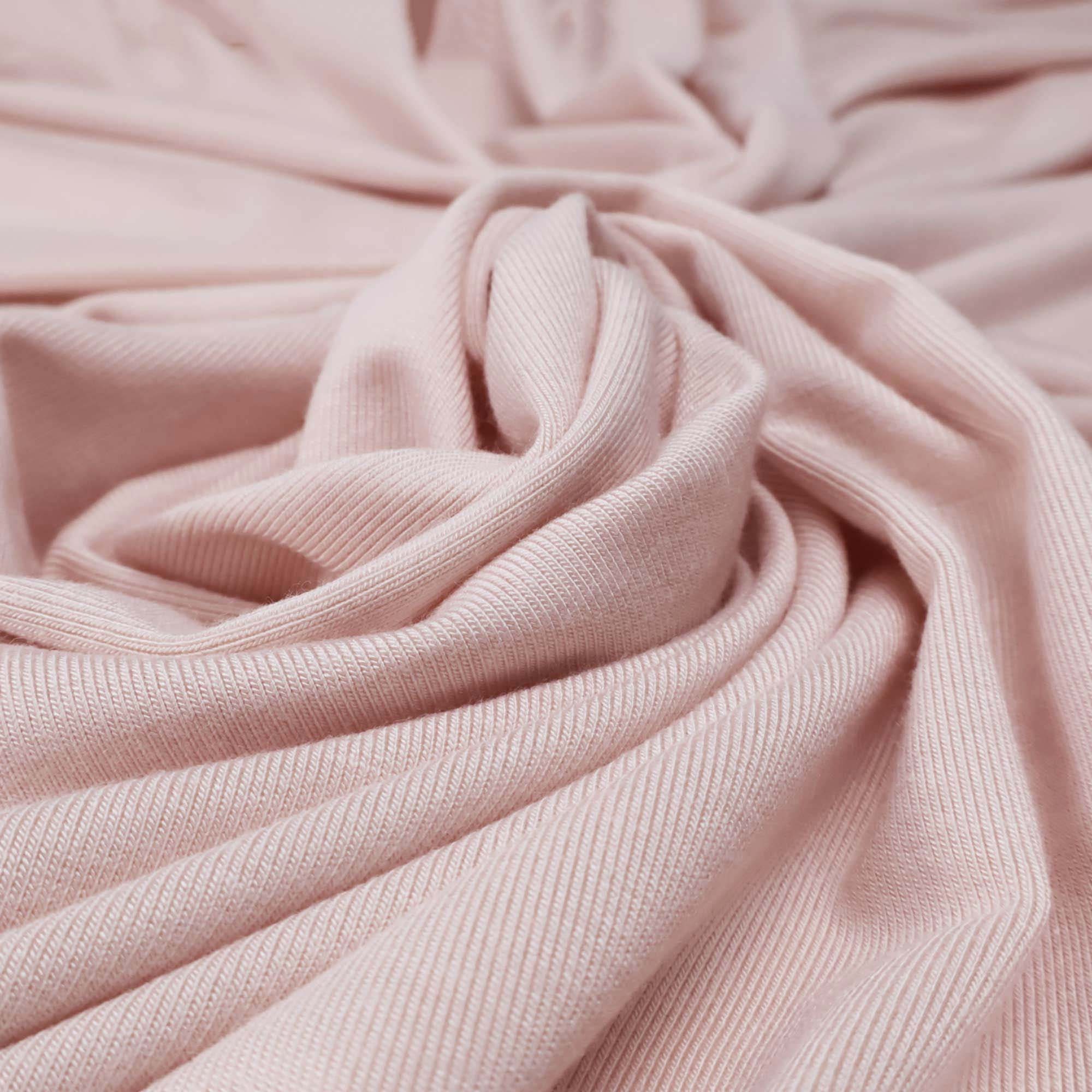 Flowy Bamboo Jersey Fabric in Shell Pink | Midweight, opaque knit fabric with fluid drape, subtle sheen, and 4 way stretch