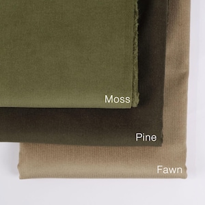 May include: Three fabric swatches in different shades of green. The top swatch is a light green called "Moss", the middle swatch is a darker green called "Pine", and the bottom swatch is a light brown called "Fawn".
