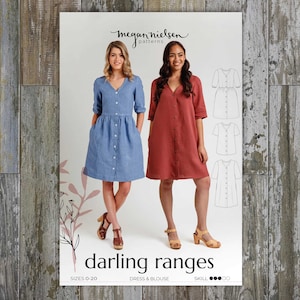 May include: A sewing pattern titled "darling ranges" featuring two women wearing button-down dresses in blue and red-orange. The pattern includes dress and blouse designs, with sizes 0-20. The brand name "megan nielsen patterns" is at the top.