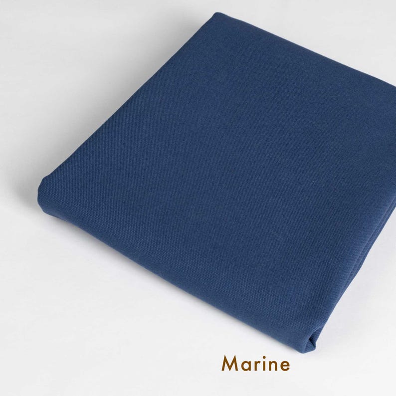 May include: A solid piece of fabric in a deep blue color, labeled "Marine".