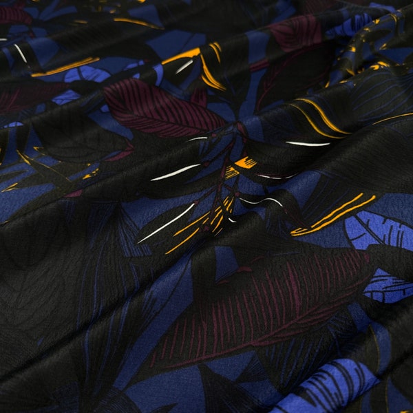 Italian Viscose Crepe Fabric in Moonlight | Designer Deadstock with a large scale jungle floral print in black, blue, merlot, and gold