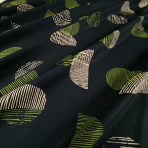 Viscose Challis Fabric in Jane Maple by Atelier Brunette | Designed in France | Silky, swishy challis with lined circles in green and cream