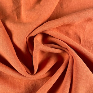 Soft-washed Lightweight Linen Fabric in Papaya Orange | Stonewashed european linen fabric by the yard for clothing