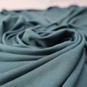 Flowy Bamboo Jersey Fabric in Peacock | Midweight, opaque knit fabric with fluid drape, subtle sheen, and 4 way stretch