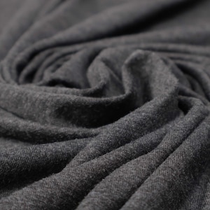 Flowy Bamboo Jersey Fabric in Charcoal Melange | Midweight, opaque knit fabric with fluid drape, subtle sheen, and 4 way stretch