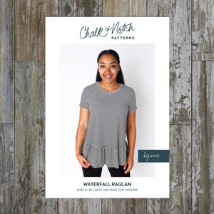 May include: A black and white striped shirt with a ruffle hem. The shirt is a beginner sewing pattern from Chalk & Notch Patterns. The pattern includes sizes 0-30 with two bust cup options. The text "Waterfall Raglan" is printed below the image.