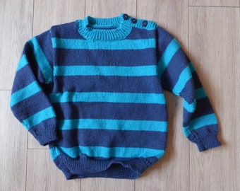 Scratched children's sweater, buttoning on the shoulder