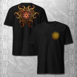 May include: Black t-shirts with a gold and red geometric design. One shirt features a large design on the back, while the other has a smaller design on the chest. The designs have intricate patterns and a symmetrical shape.