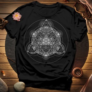 a black t - shirt with a white design on it
