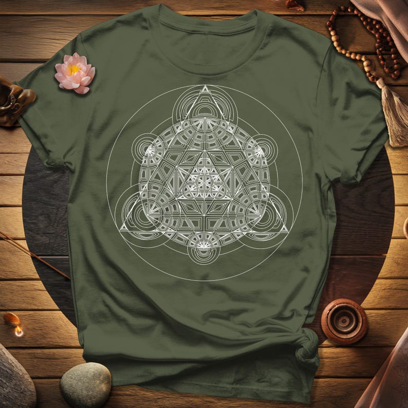 a green t - shirt with a white design on it